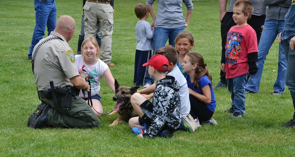 K9 Arthur enjoys pets from the kids after working hard - photo by Gina Clugston