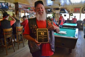 Clampers Humbug JJ Skeen with plaque for Buckhorn Saloon - photo by Gina Clugston
