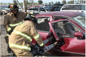 CAL FIRE Engineer Daniel Valenzuela, former Madera County PCF, volunteering his off-duty time as PCF academy instructor, is shown supervising a PCF recruit in the operations of the “Jaws of Life”