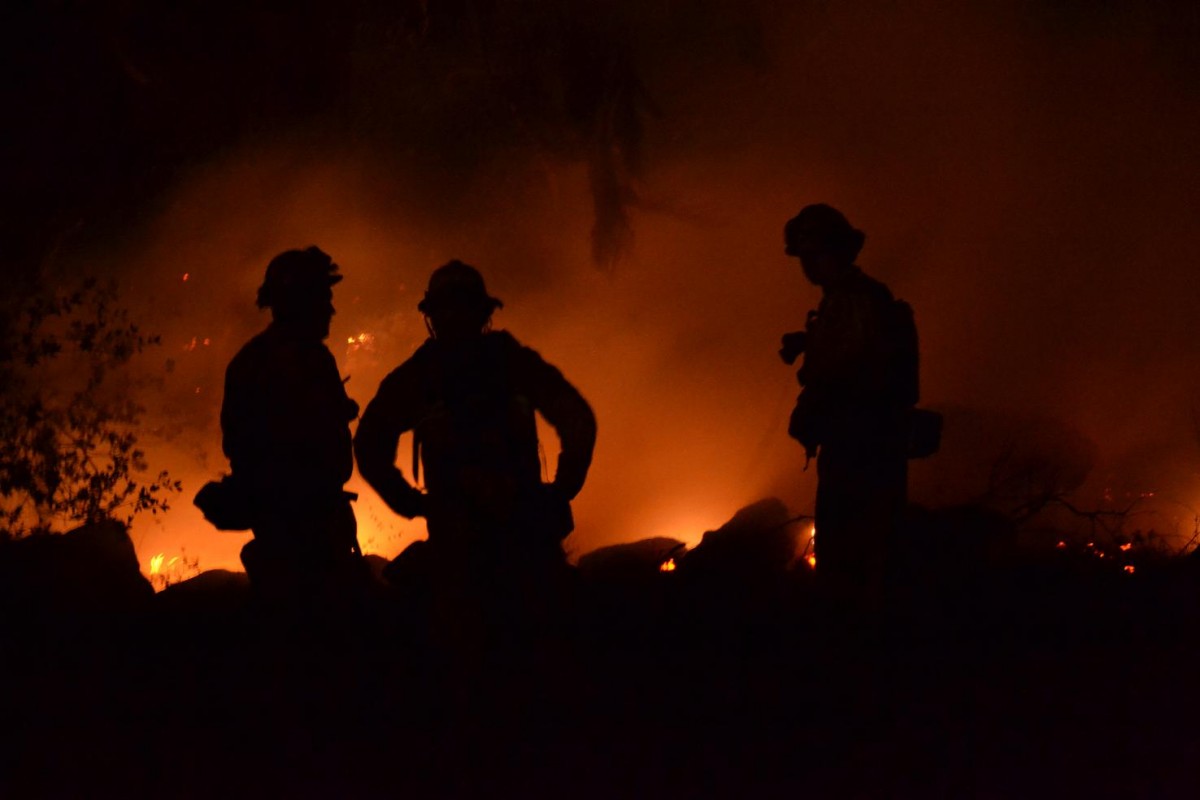 Three firefighters sillouette Revis Circle - photo by Gina Clugston