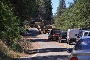 Loaders moving logs out of Road 223 - photo by Gina Clugston