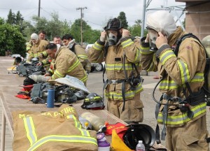 PCF recruits donning their personal protective equipment, including self-contained breathing apparatus for Structure Day - photo by Bill Ritchey