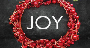 Picture of a wreath with the word JOY in the center