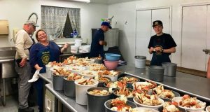 Picture of kitchen workers at the crab feed.