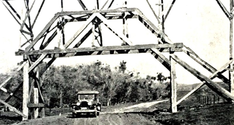 Antique picture of truck driving under water flume.