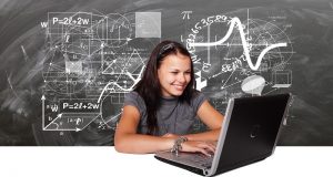 Picture of young woman typing on laptop.