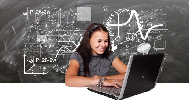 Picture of young woman typing on laptop.