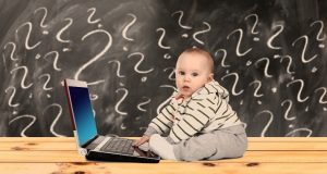 Image of a baby on a computer.
