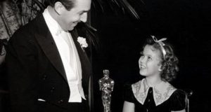 Image of Walt Disney and Shirley Temple at the Oscars.
