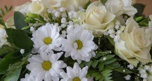 Image of white funeral flowers.