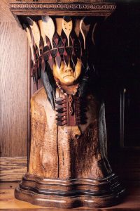 Image of a wooden sculpture of Chief Tenaya. 