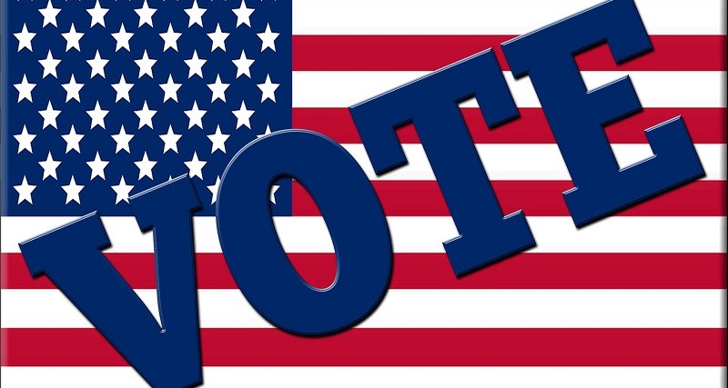 Image of a USA flag with the word vote on it.