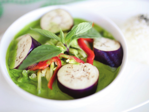 Image of a bowl of green curry. 