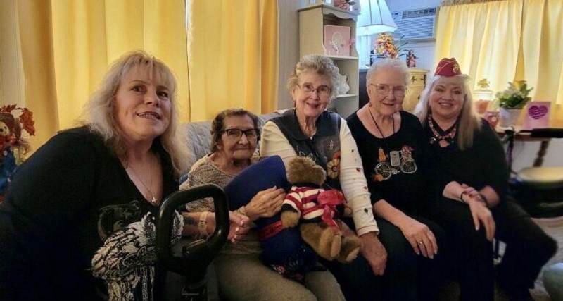 Image of some ladies sitting on a couch.
