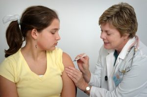 Image of a woman getting a flu shot.
