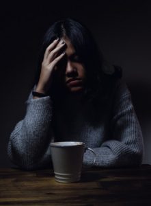 Image of a woman with the flu. 