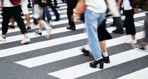 Image of people crossing a crosswalk. 