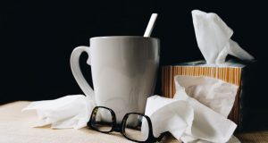 Image of Kleenex and a cup of coffee.