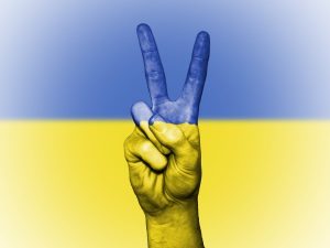 Image of a peace sign in Ukrainian colors. 