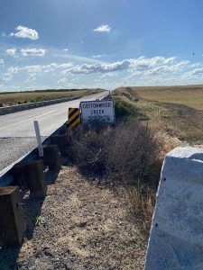 Image of the Cottonwood Creek Bridge, with monument.