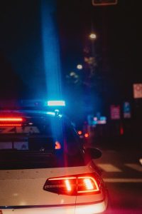 Image of a police car at night.