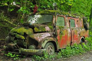 Image of a rusted-out, old fire truck. 