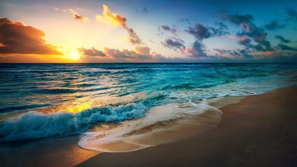 Image of a beach at sunrise.