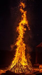Image of a burn pile at night.