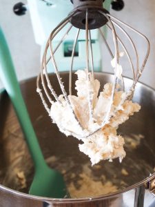 Image of whipped cream on a whisk.