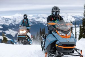 Image of people snowmobiling.
