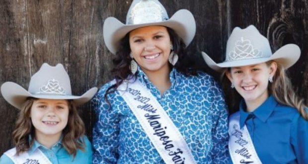 Image of three young female rodeo winners.