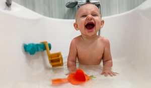 Image of a baby in a bathtub.
