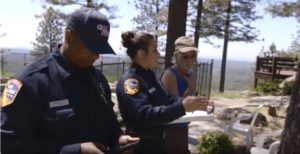 Image of CAL FIRE Defensible Space Inspectors providing preparedness tips to homeowner.
