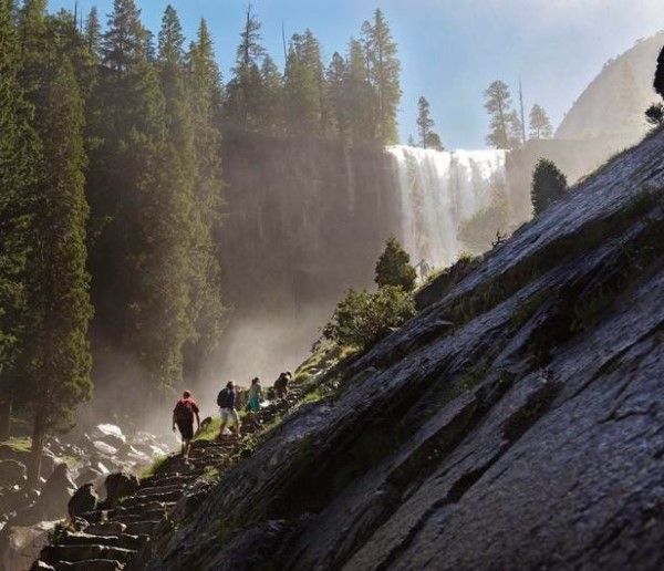 Image of a group of people walking up a mountain in Yosemite. 