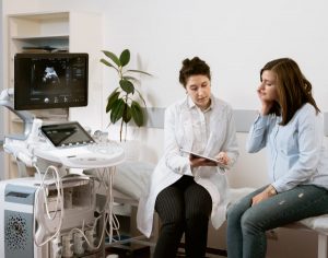 Image of a doctor talking to a patient.