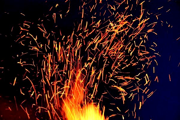Image of burning embers flying through the air.
