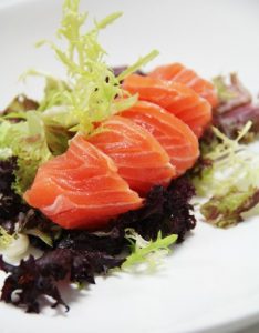 Image of raw salmon on a plate.