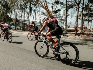 Image of people cycling in a triathlon. 