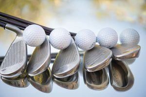 Image of golf clubs and balls. 