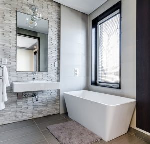 Image of a mostly white bathroom with tub. 