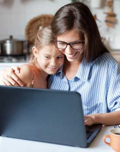 Image of a mother and daughter looking at a computer screen.