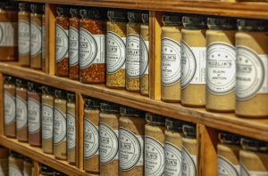 Image of jars of mustard on a store shelf.