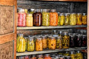 Image of canned vegetables in a root cellar.