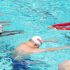 Image of Darina Khisiamova giving swim lessons.