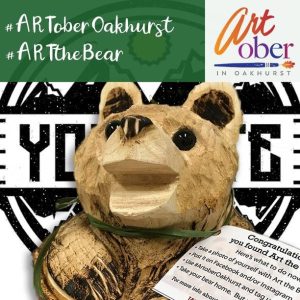 Image of Art the Bear. A wooden carved bear that the mascot of Artober