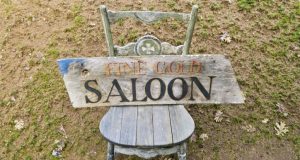 Image of a sign from the Fine Gold Saloon.
