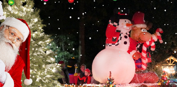 Image of Santa in front of a christmas tree and a giant snowman