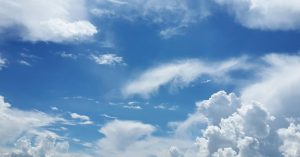 Image of white clouds against a blue sky.
