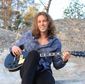 Image of Eric Tyler with his guitar