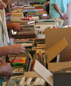 Image of a bunch of books at a book sale.